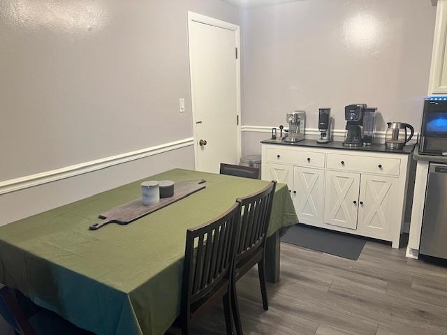 dining area featuring wood-type flooring