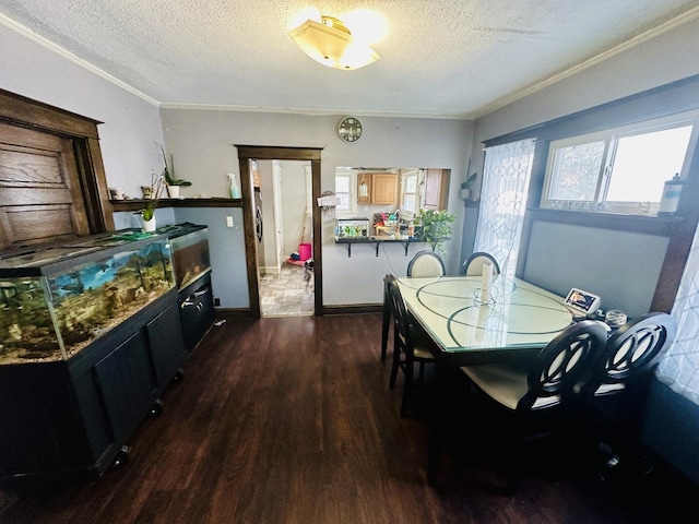 dining room featuring a textured ceiling, ornamental molding, and dark hardwood / wood-style floors