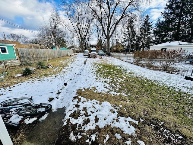 view of yard layered in snow