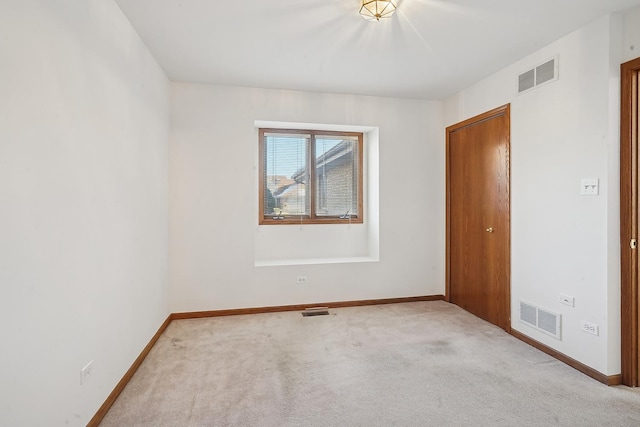 view of carpeted spare room