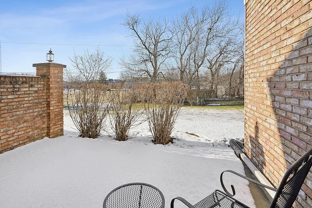 view of snow covered patio