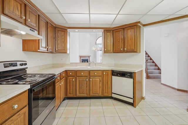 kitchen featuring dishwasher, pendant lighting, stainless steel electric range, sink, and a paneled ceiling