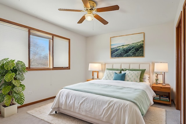 bedroom with ceiling fan and light colored carpet