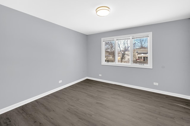 unfurnished room featuring dark hardwood / wood-style flooring