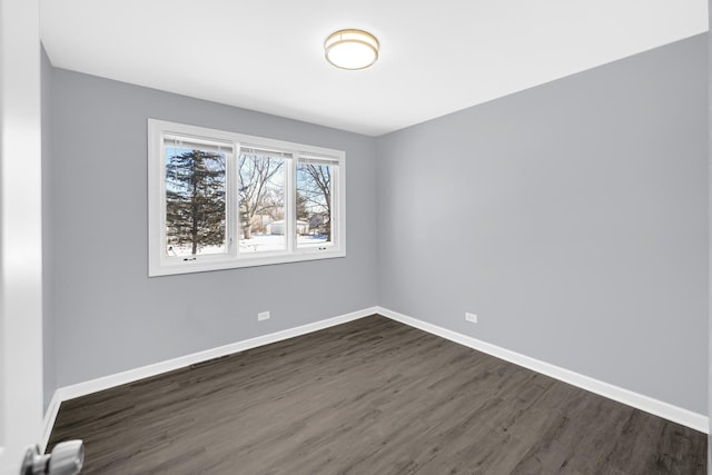 unfurnished room featuring dark hardwood / wood-style floors