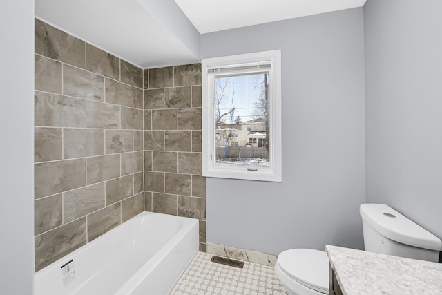 bathroom featuring toilet and vanity