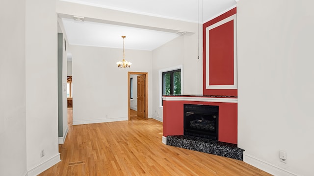 interior space featuring a chandelier and hardwood / wood-style floors