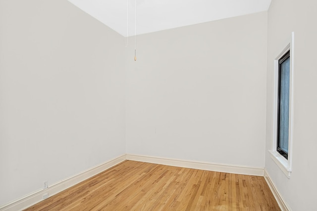 spare room with hardwood / wood-style floors and a wealth of natural light