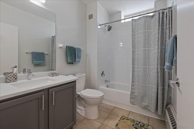 full bathroom featuring tile patterned flooring, toilet, vanity, and shower / bath combo