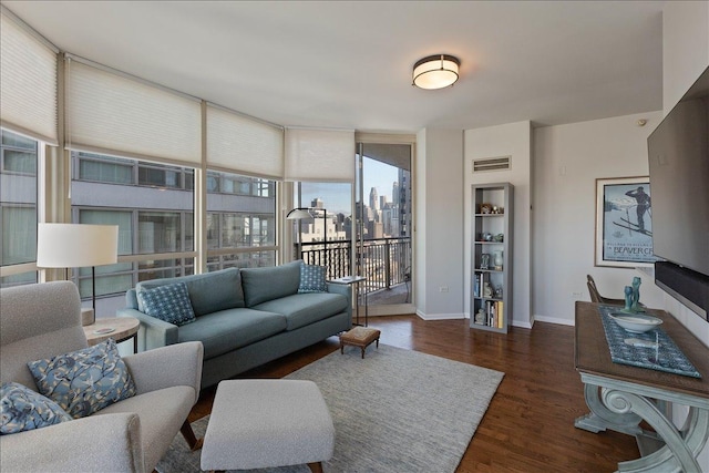 living room with dark wood-type flooring and expansive windows