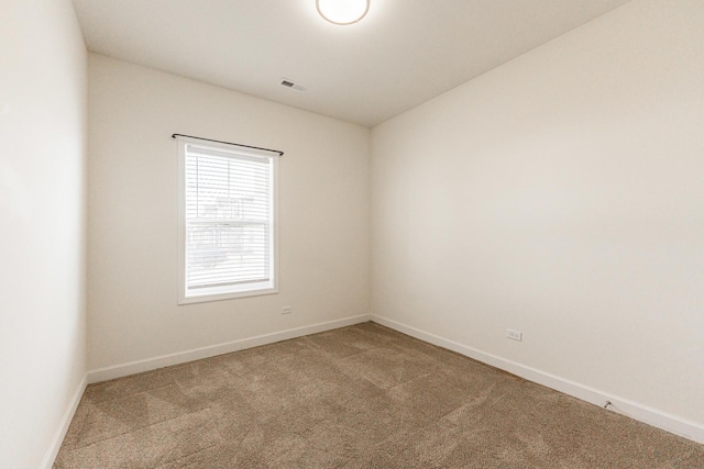 empty room featuring light carpet