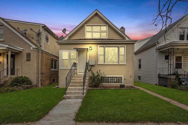 bungalow-style house featuring a yard