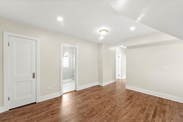 empty room with dark hardwood / wood-style floors