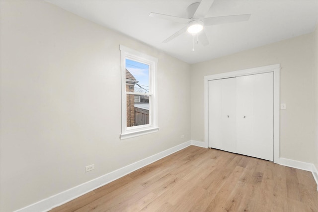 unfurnished bedroom featuring a closet, ceiling fan, and light hardwood / wood-style flooring