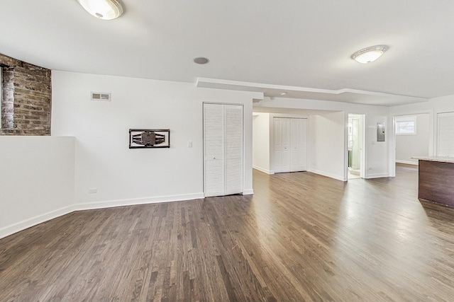 spare room with dark hardwood / wood-style flooring