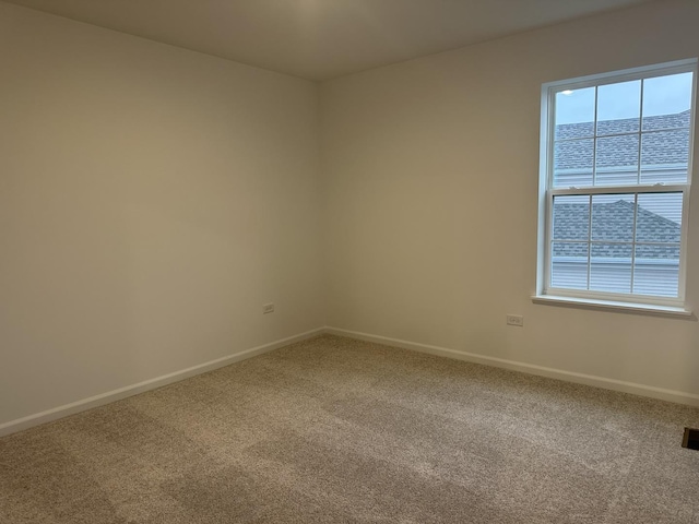 unfurnished room featuring carpet floors