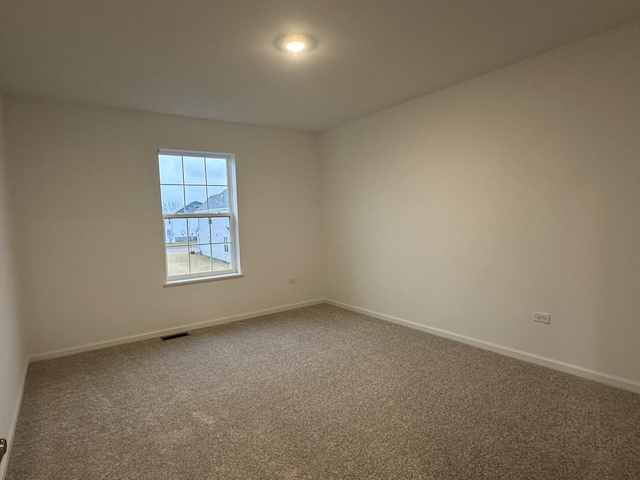 unfurnished room featuring carpet