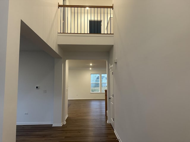 corridor featuring dark hardwood / wood-style floors