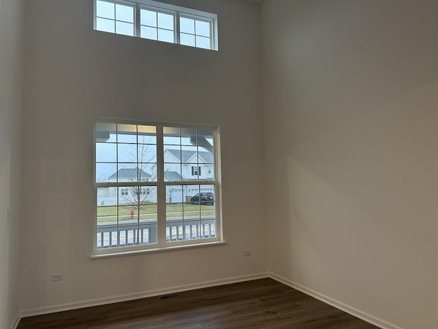 empty room featuring dark hardwood / wood-style floors