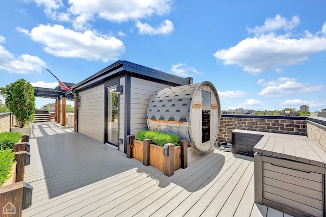 wooden deck featuring a pergola