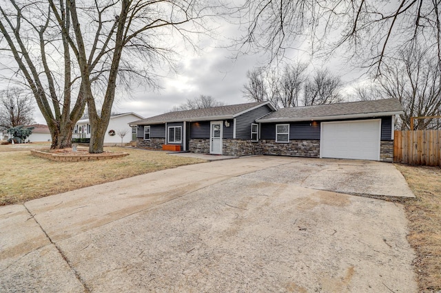 ranch-style house with a garage and a front yard