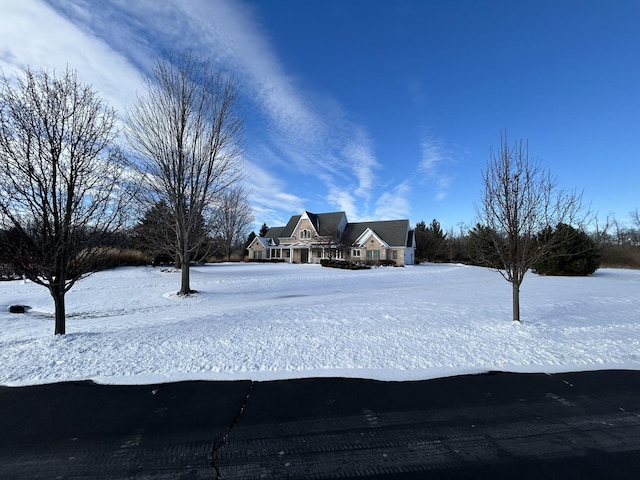 view of yard layered in snow