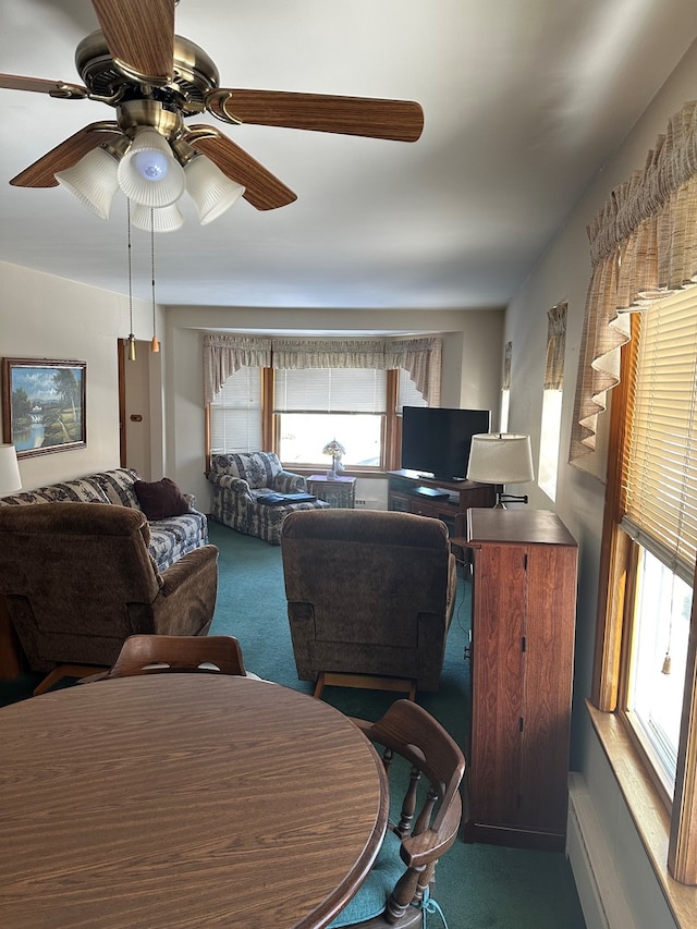 living room with ceiling fan and carpet flooring