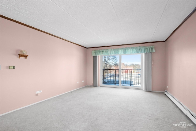 spare room featuring ornamental molding, a baseboard heating unit, and light colored carpet