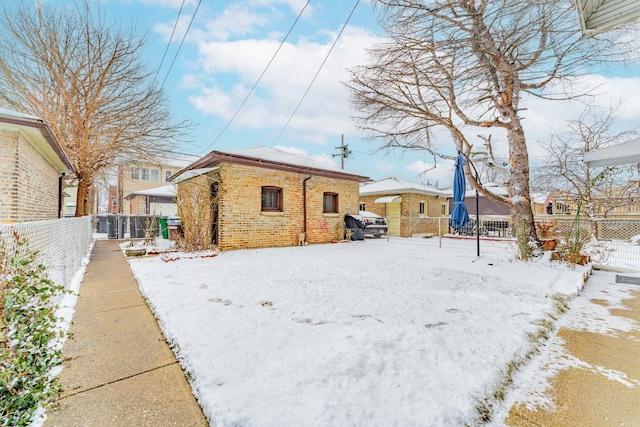 view of snow covered property