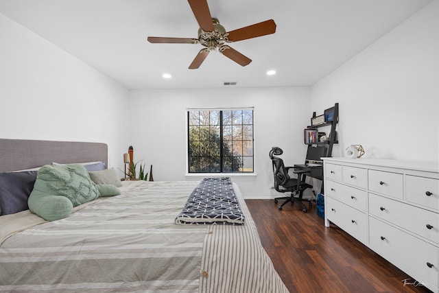 bedroom with ceiling fan and dark hardwood / wood-style floors