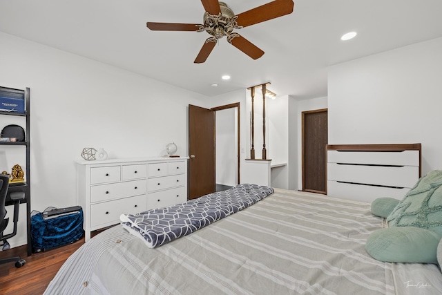 bedroom with ceiling fan and hardwood / wood-style floors