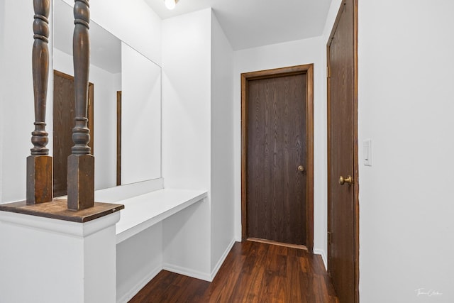 corridor featuring dark hardwood / wood-style floors