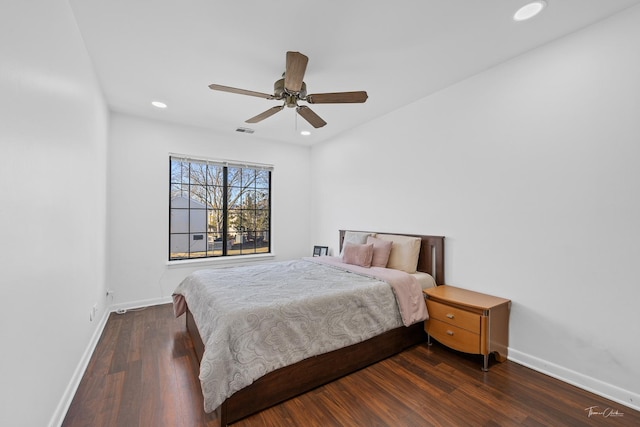 bedroom featuring ceiling fan and dark wood-type flooring