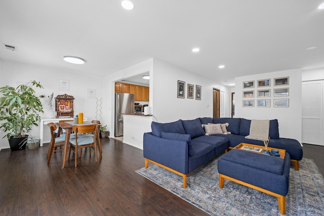 living room with dark hardwood / wood-style floors