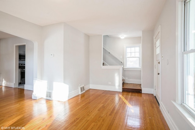 spare room with hardwood / wood-style floors