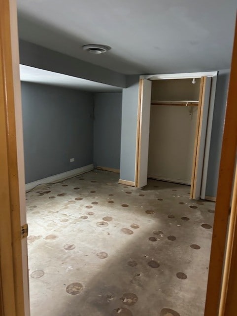 unfurnished bedroom with a closet