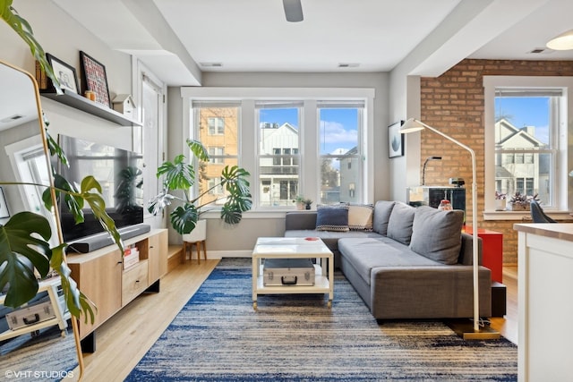 interior space featuring wood-type flooring and brick wall