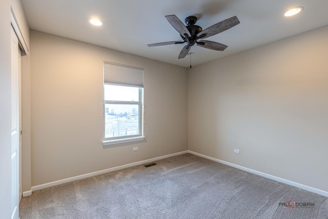 carpeted empty room with ceiling fan