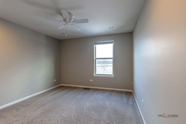 empty room featuring ceiling fan and carpet flooring