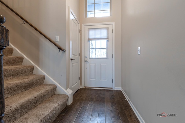 doorway to outside with a healthy amount of sunlight and hardwood / wood-style flooring