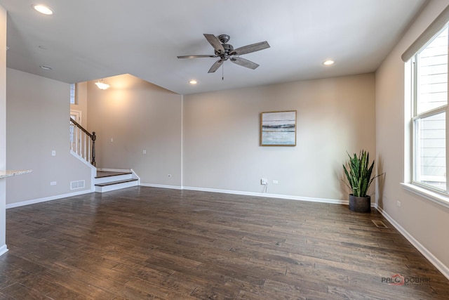 unfurnished living room with ceiling fan and dark hardwood / wood-style floors