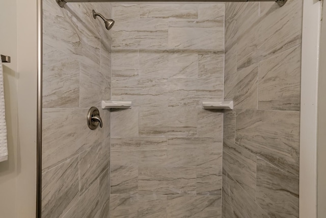 bathroom with tiled shower