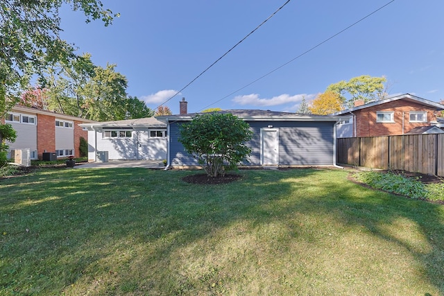 rear view of house with a lawn