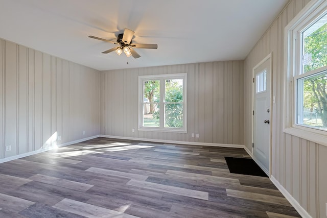 spare room featuring ceiling fan and dark hardwood / wood-style floors