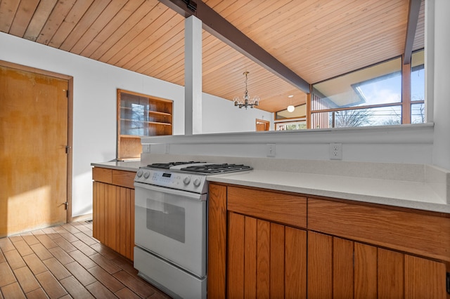 kitchen featuring vaulted ceiling with beams, hardwood / wood-style flooring, wood ceiling, gas range gas stove, and an inviting chandelier