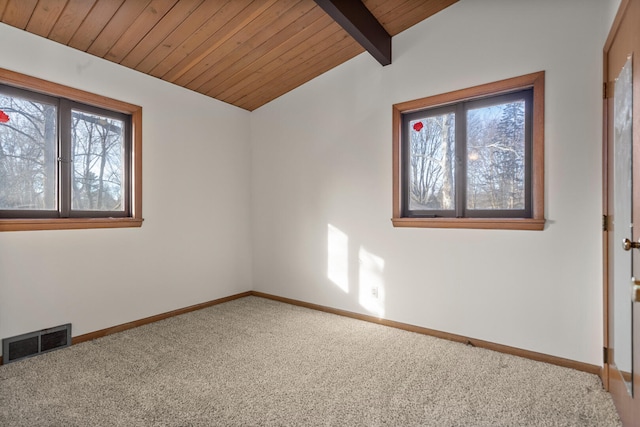 carpeted spare room featuring lofted ceiling with beams and wooden ceiling