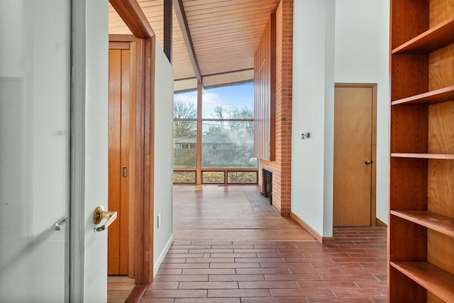 corridor featuring a wall of windows and wood-type flooring