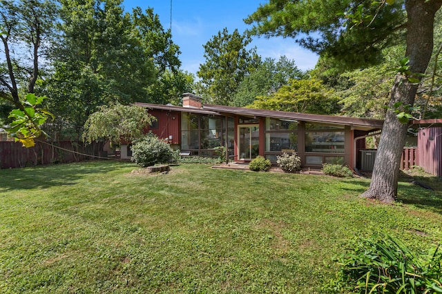 view of yard with a sunroom