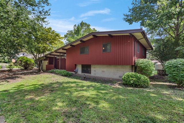 view of property exterior featuring a yard