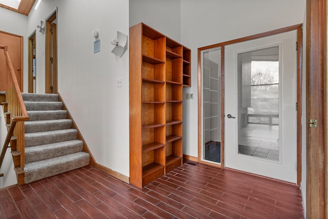 doorway to outside with a skylight